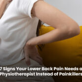 Physiotherapist assessing a patient with persistent lower back pain during a treatment session to provide long-term pain relief.