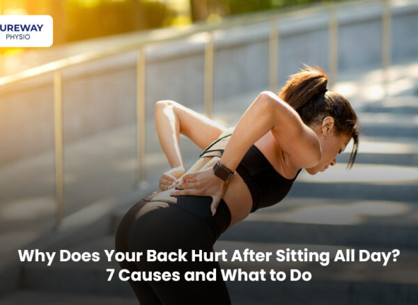 Person experiencing back pain after sitting at a desk all day