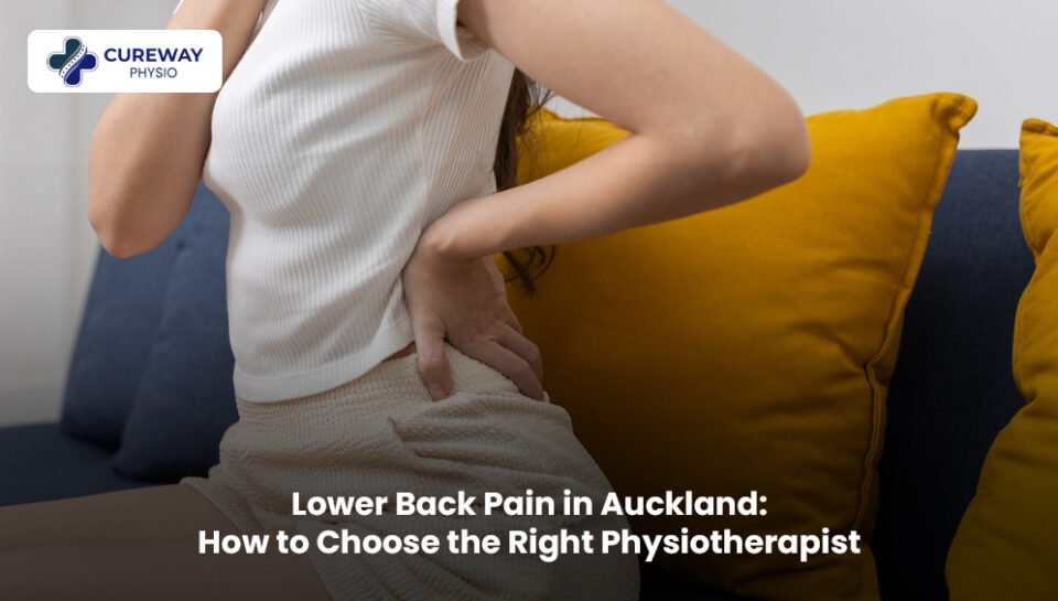 Physiotherapist helping a patient with lower back pain in Auckland